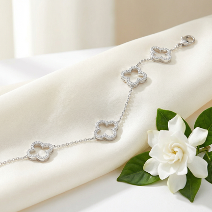 Clover Bracelet — Silver & Diamonds — styled on ivory silk with gardenia